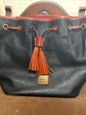 Dooney & Bourke Black Pebbled Leather Tote with Brown leather Trim and Tassel